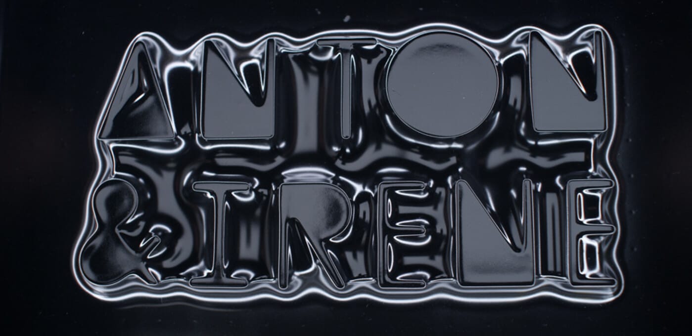 Two-line, glossy chrome 3D lettering with a liquid-metal texture on a dark background.