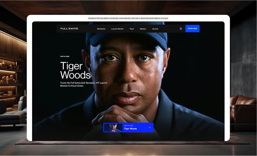 Close-up of a person wearing a cap on a dark screen, with white text and a blue control bar, framed by a white display in a modern room.