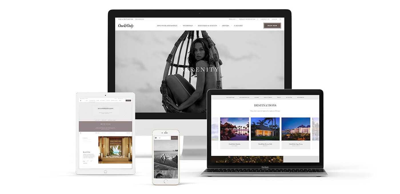 A set of devices—a desktop monitor, laptop, tablet, and two smartphones—displaying a travel website with a large grayscale hero image and destination thumbnails.