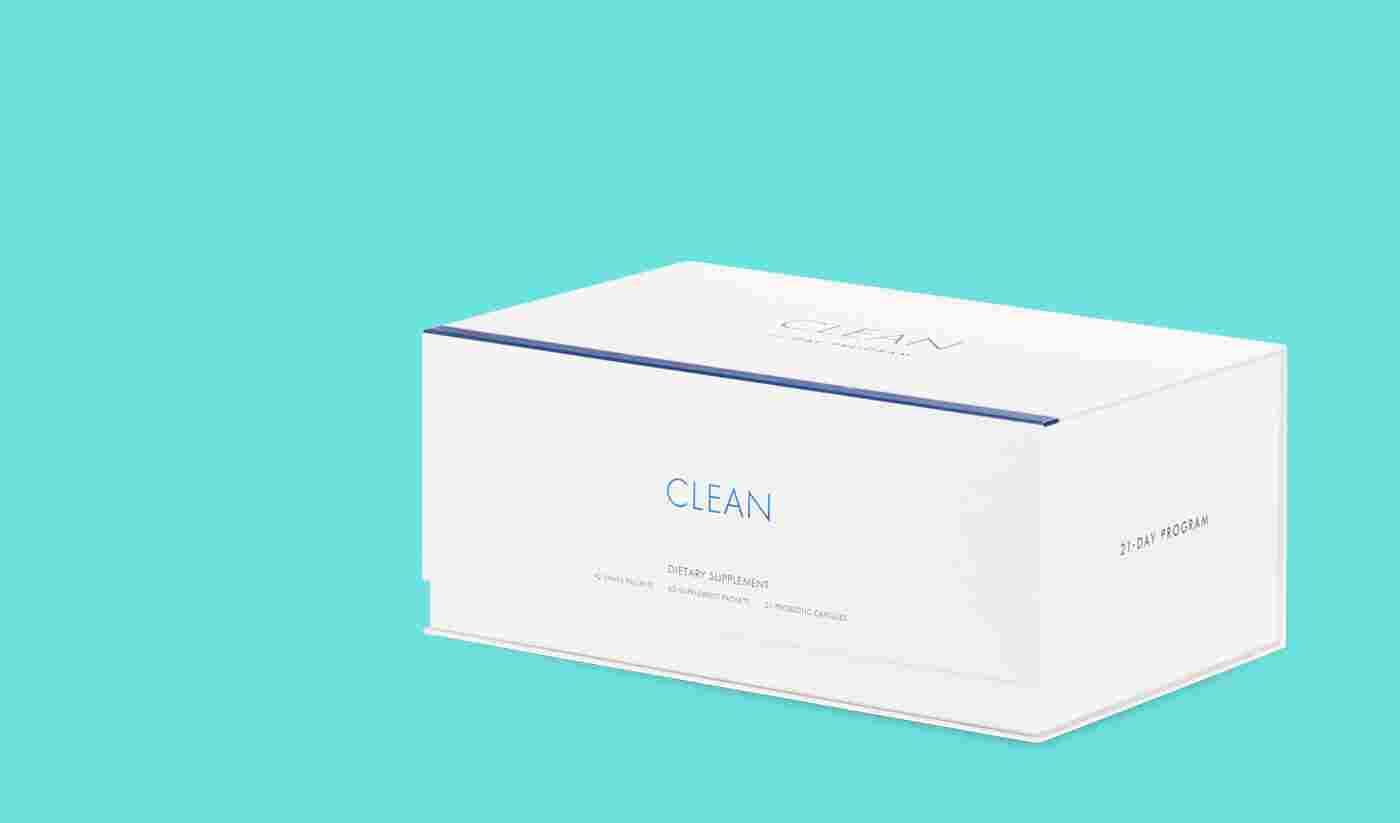 White rectangular product box labeled CLEAN in blue, shown in perspective on a teal background; side reads 21-DAY PROGRAM.