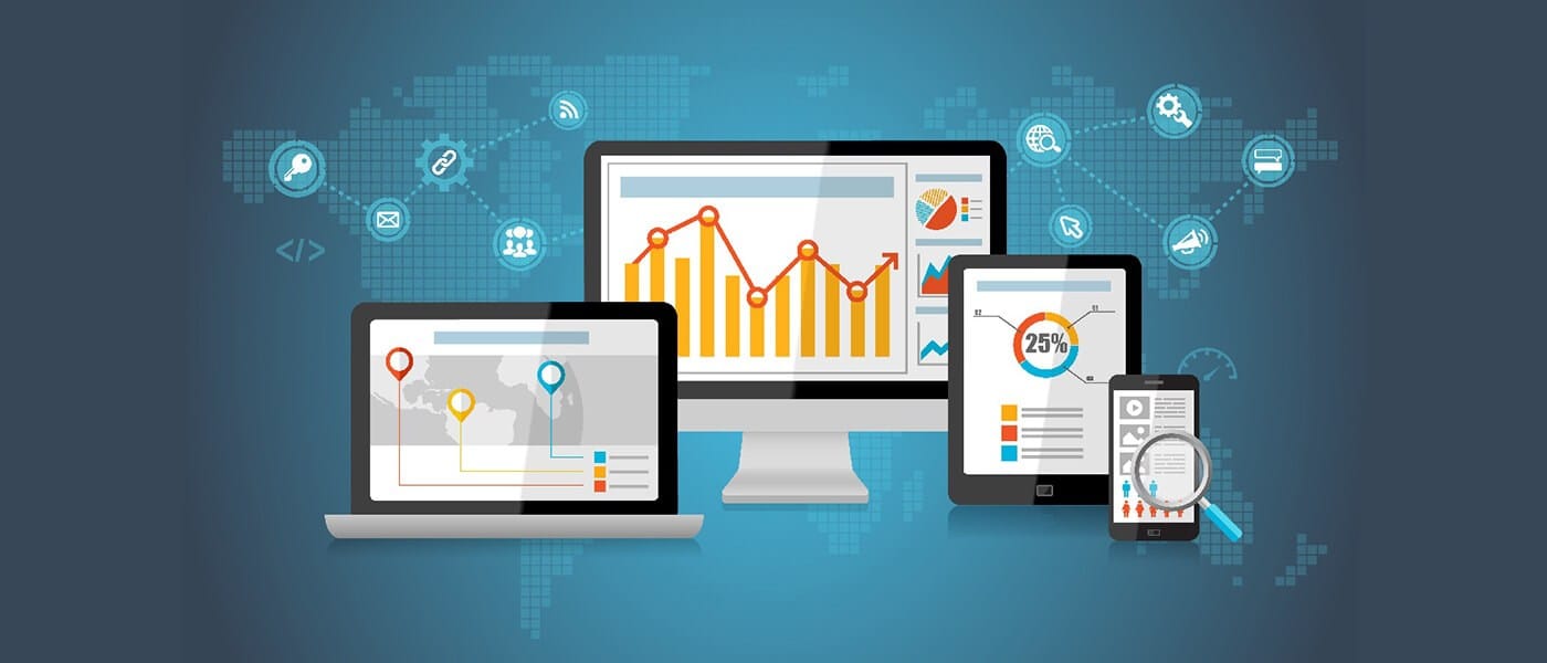 A laptop, desktop monitor, tablet, and smartphone display charts, graphs, a world map, and analytics icons, illustrating data analytics and connectivity.