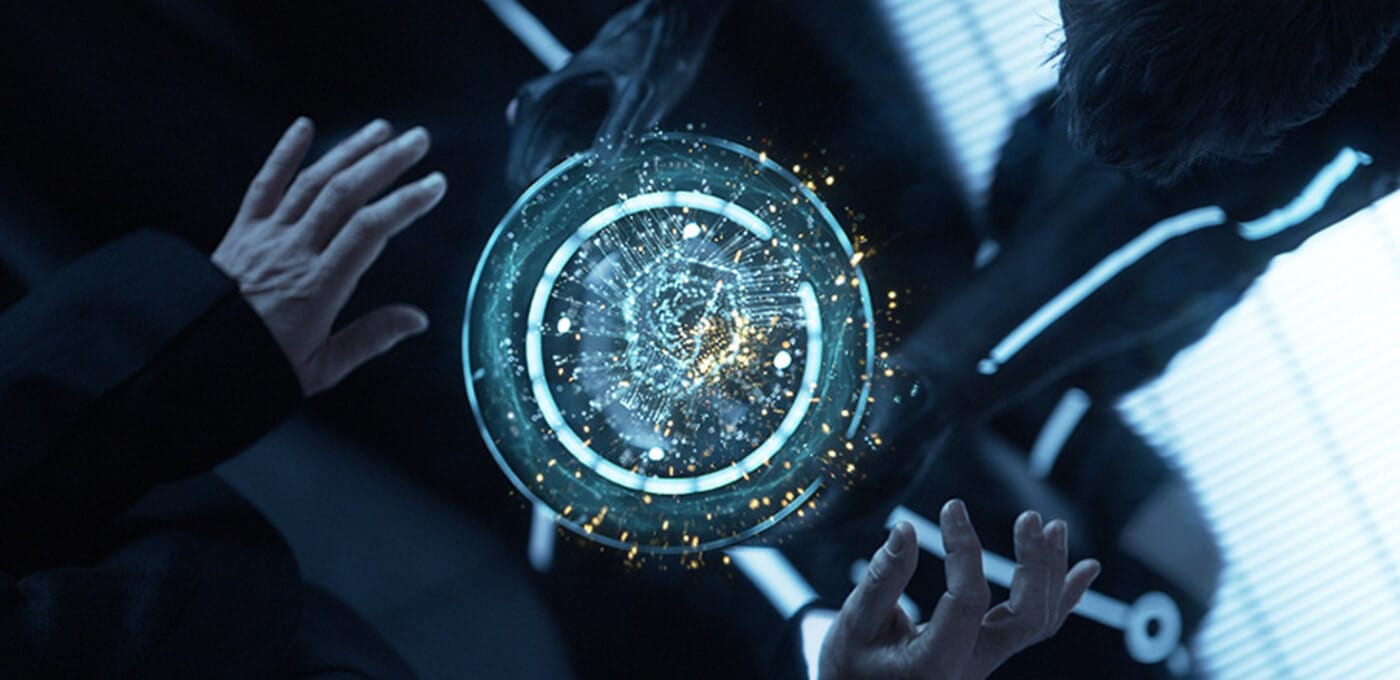 Two hands reach toward a glowing circular holographic interface with concentric rings and sparkling particles in a dark, futuristic scene.