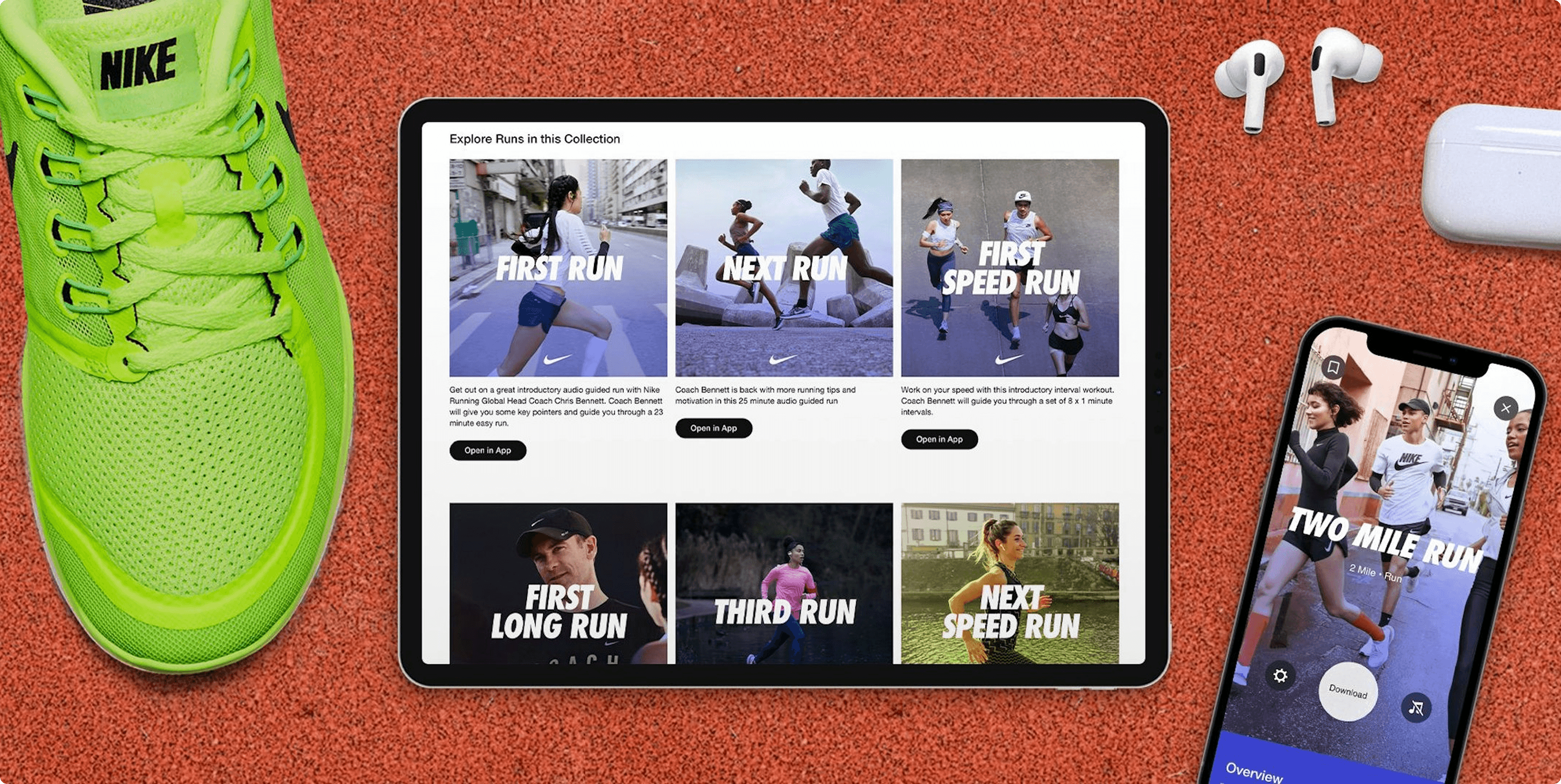 A flat lay image featuring a vibrant green Nike running shoe on the left, a tablet in the center displaying a "Explore Runs in this Collection" interface with various guided run options like "FIRST RUN," "NEXT RUN," and "FIRST SPEED RUN," and a smartphone on the right showing a "TWO MILE RUN" interface. White wireless earbuds are placed above the smartphone. The background is a red running track surface.