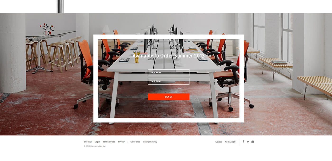 Open conference area with white desks and orange chairs; a white frame overlay reads "Available to Order Summer 2013" with name/email fields and a red Sign Up button.